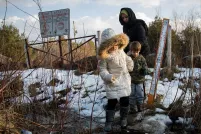 A mother with two children crossing the US-Canada border.