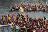 A couple hundred people in 20 canoes.