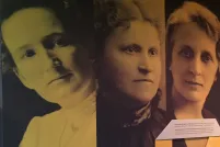 Large photographs of five women on the wall of a Museum exhibit. They are the "Famous Five" - Nellie McLung, Emily Murphy, Irene Parlby, Louise McKinney and Henrietta Edwards. 