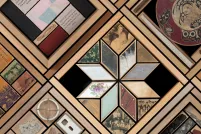 Portion of a large artwork consisting of objects set in cedar frames.