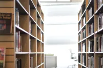 Brightly lit bookshelves.