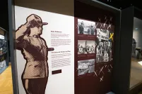 Exhibition panel with an image of an RCMP officer standing at attention and text that read "State Enforcers."