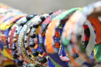 A display of colourful beaded bracelets are displayed for sale.