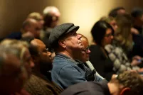 People sitting in an audience.