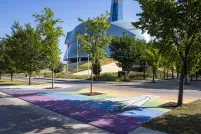 Pride flag pedestrian crosswalk across from the Canadian Museum for Human Rights.