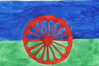 A painting of the Romani flag, which is blue on top, green on the bottom and has a red chakra that looks like a wagon wheel in the centre.