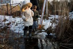 A mother with two children crossing the US-Canada border.