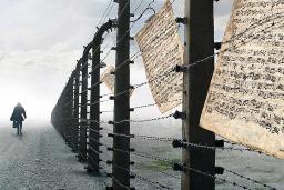 A person walking by a barbed-wire fence. Sheet music is caught in the wire.
