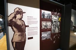 Exhibition panel with an image of an RCMP officer standing at attention and text that read "State Enforcers."