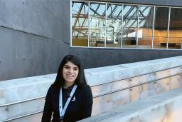 A smiling woman on the alabaster ramps of the Museum.