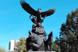 The National Aboriginal Veterans monument, an outdoor statue featuring three Indigenous veterans, a bear, a wolf and an eagle taking flight on top.