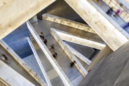 Looking down through the Museum’s criss-crossing alabaster ramps as people move through them.