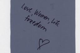 Piece of cloth with "Women, Life, Freedom" written.