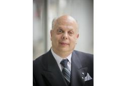 A portrait photo of David Lepofsky, an older man in a suit and tie.