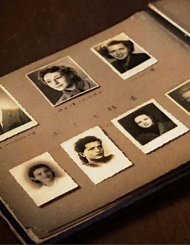 An open photo album contains black-and-white headshots of seven individuals and other annotated photos Partially obscured.