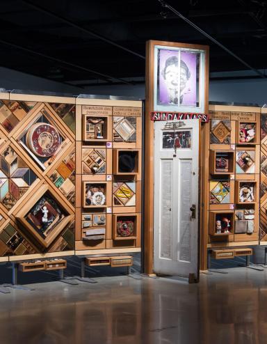 Large artwork consisting of objects set in cedar frames.