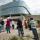 A group of people watching a choir as they perform on the Museum’s exterior amphitheater.