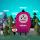 Cartoon drawing of a three-eyed pink monster and two human figures in front of a landscape of trees, buildings and mountains.