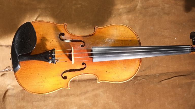 A violin. Partially obscured.