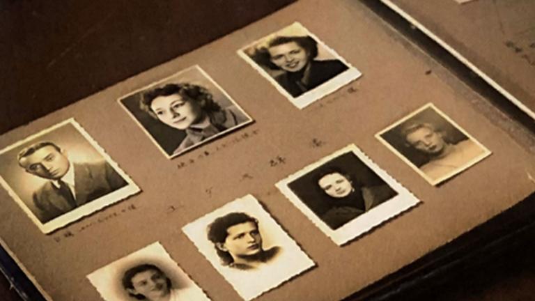An open photo album contains black-and-white headshots of seven individuals and other annotated photos Partially obscured.