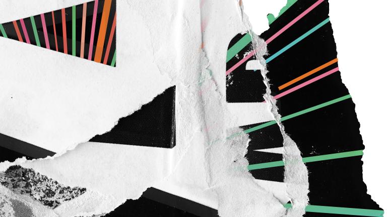 A bundle of torn black and white paper with layers of multicolored pastel stripes. Partially obscured.