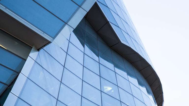 A close-up view of the large panes of glass that surround one half of the Museum.