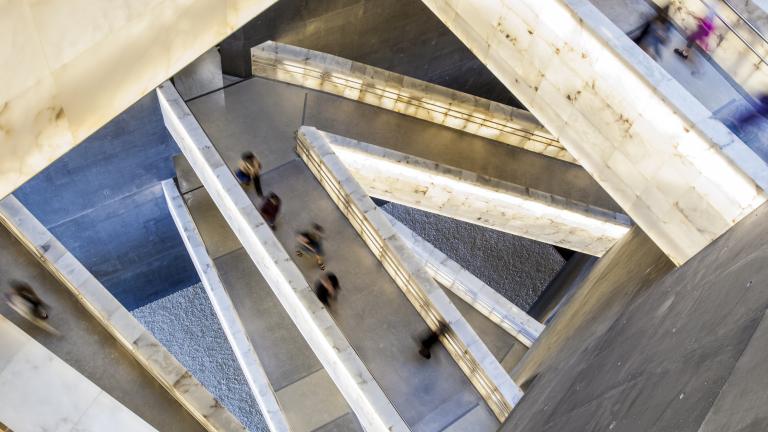 Looking down through the Museum’s criss-crossing alabaster ramps as people move through them.