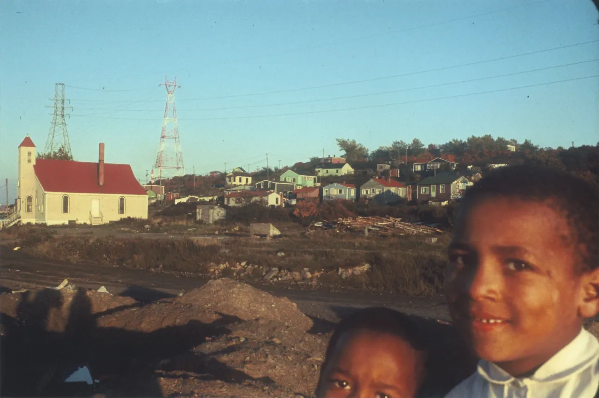  Two children looking at the camera and smiling