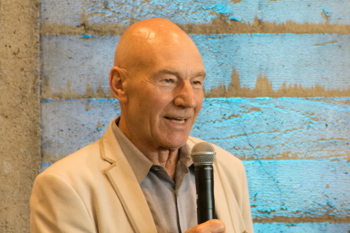 A man speaks into a microphone.