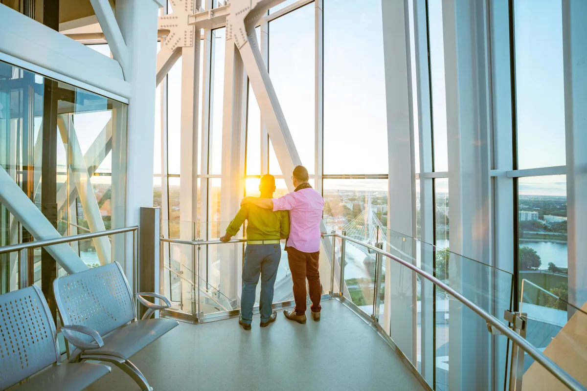 A couple looking at the city view from the tower.
