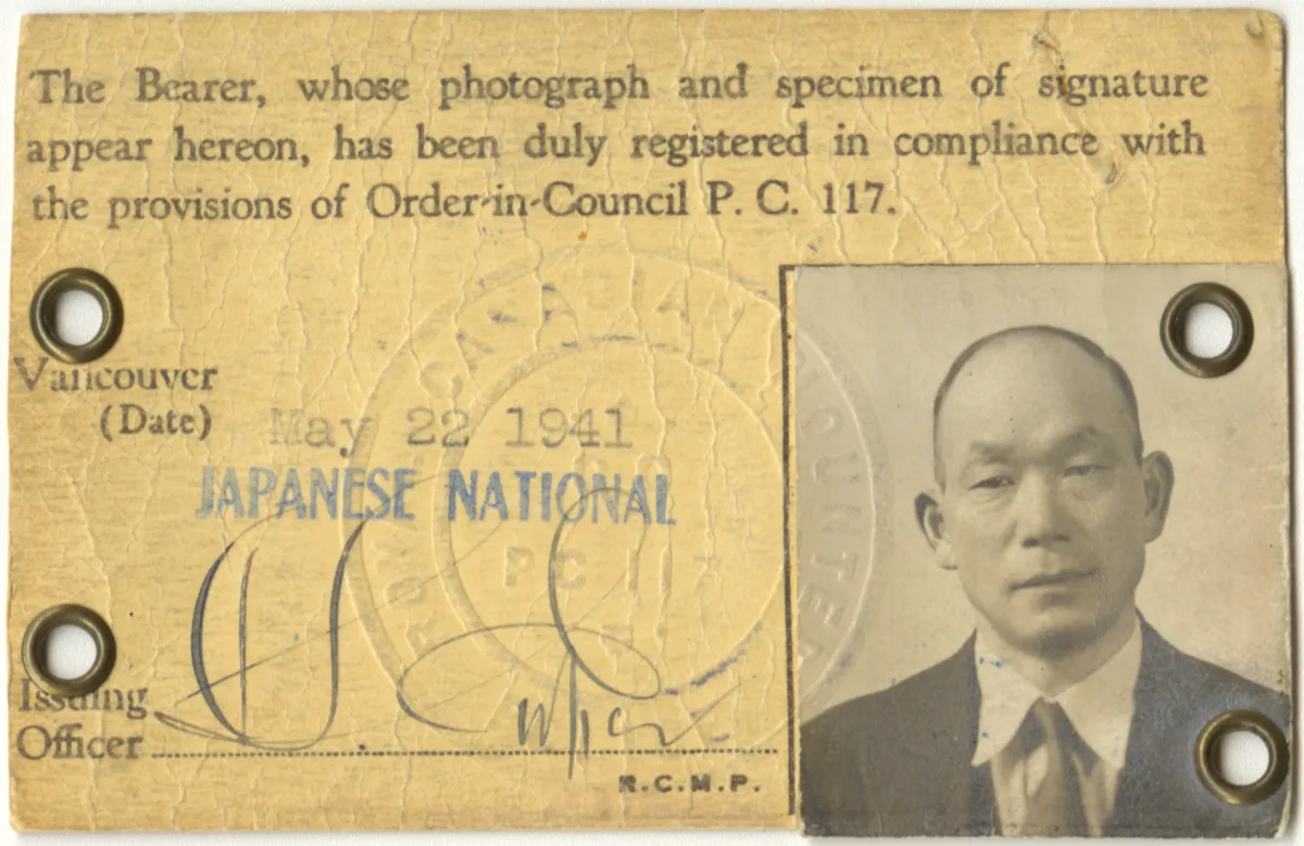 Identification card with the image of a man in the lower right corner.