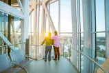 A couple looking at the city view from the tower.