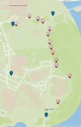 A map of The Forks area with markers showing locations of artworks and information kiosks. Red markers with numbers one through thirteen, indicating artwork locations, are placed along a path starting at the Canadian Museum for Human Rights and moving south towards the Oodena Celebration Circle. Four blue markers showing the location of information kiosks are placed near the entrances to The Forks.