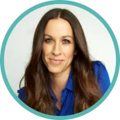 A middle-aged woman with long dark hair wears a blue blouse.