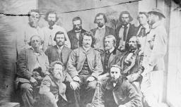 Posed photograph of a group of men.