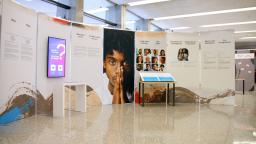 A freestanding set of panels presenting text, video and interactive digital displays.