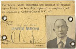 Identification card with the image of a man in the lower right corner.