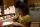 Girl writing with a pencil on paper