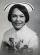 Yearbook photo of a woman wearing a white nurse’s cap.