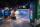 A museum gallery featuring artwork projected onto large screens and colourful geometric shapes.