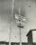 Black and white photo of three signs on a post, reading “Christians only,” “Jews not allowed” and “Danger.”