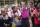 Girls holding Days for Girls Sewing Bee menstrual product bags.