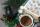 Close-up of someone pouring coffee from a Jebena, a traditional Ethiopian coffee pot.