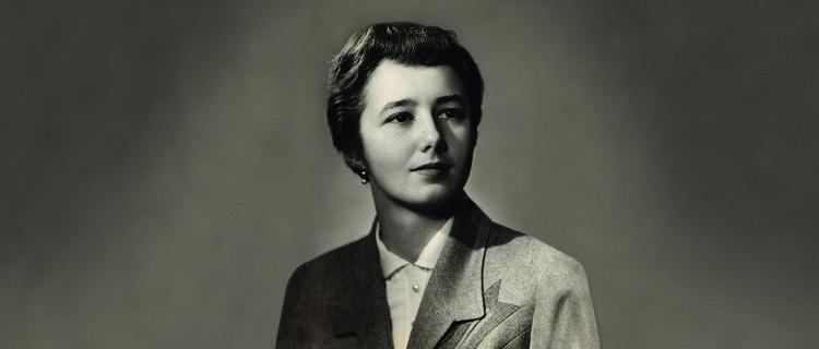 Black and white portrait of a woman looking to our right. Partially obscured.