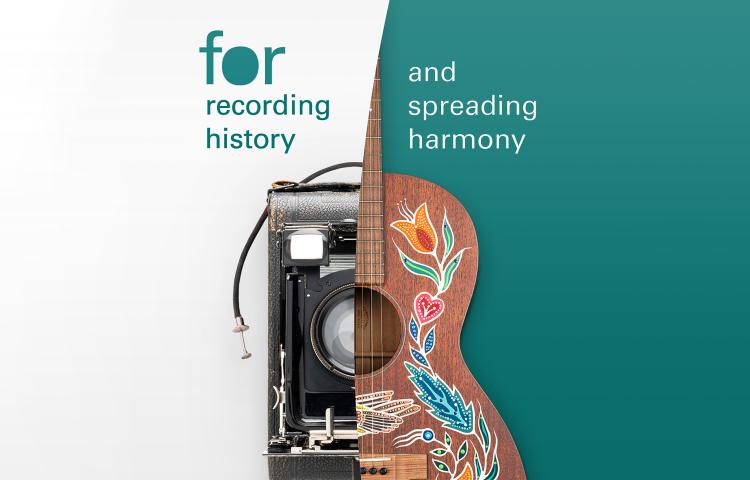 A 1940s-era camera and an acoustic guitar decorated with painted patterns. Partially obscured.