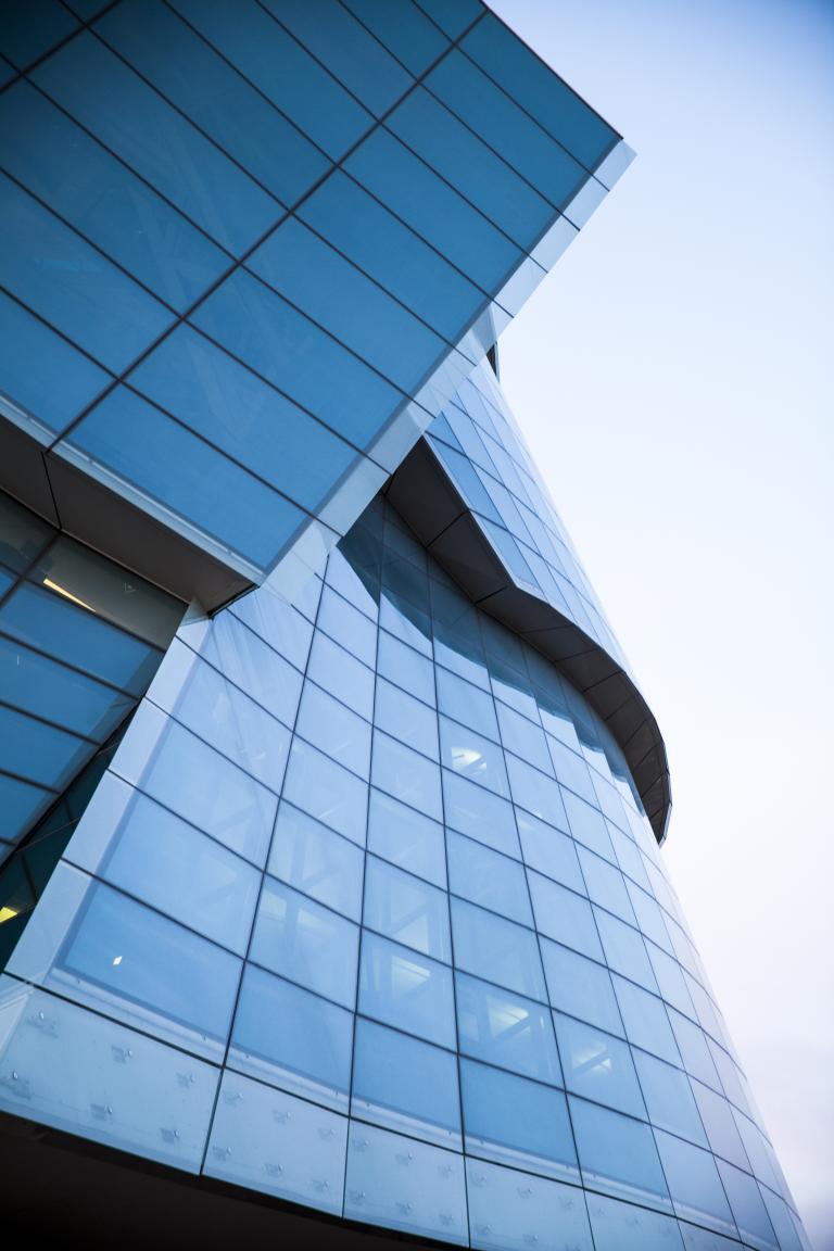 A close-up view of the large panes of glass that surround one half of the Museum.