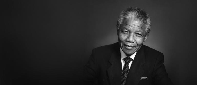 Black and white portrait of Nelson Mandela Partially obscured.