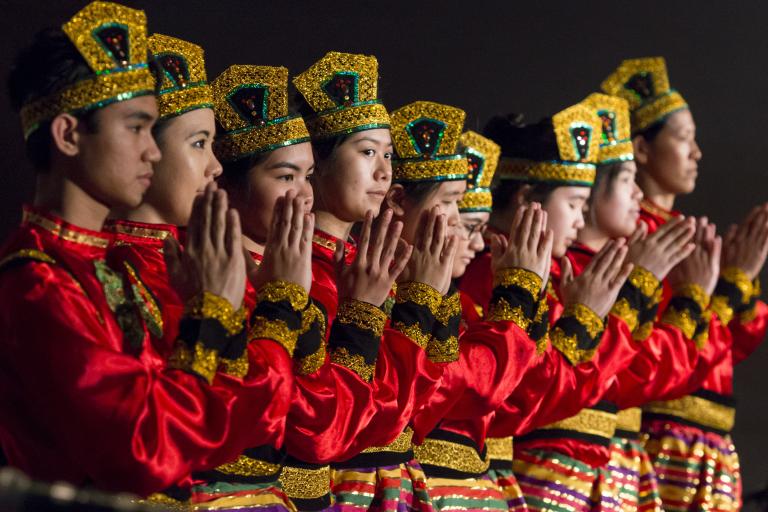 Dancers in traditional dress Partially obscured.