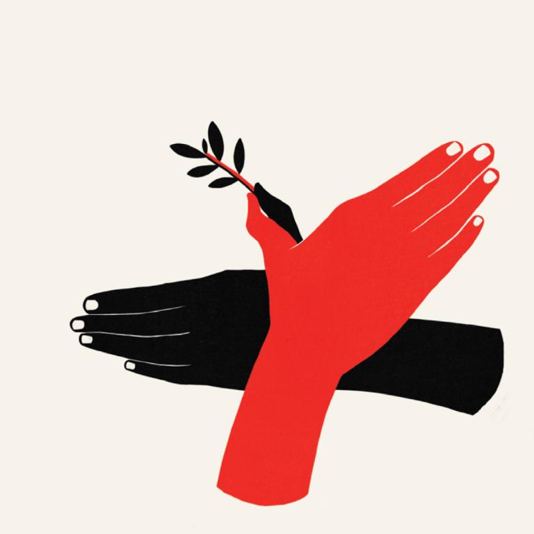 Two hands placed one over the other in the shape of a bird, that hold an olive branch. Partially obscured.