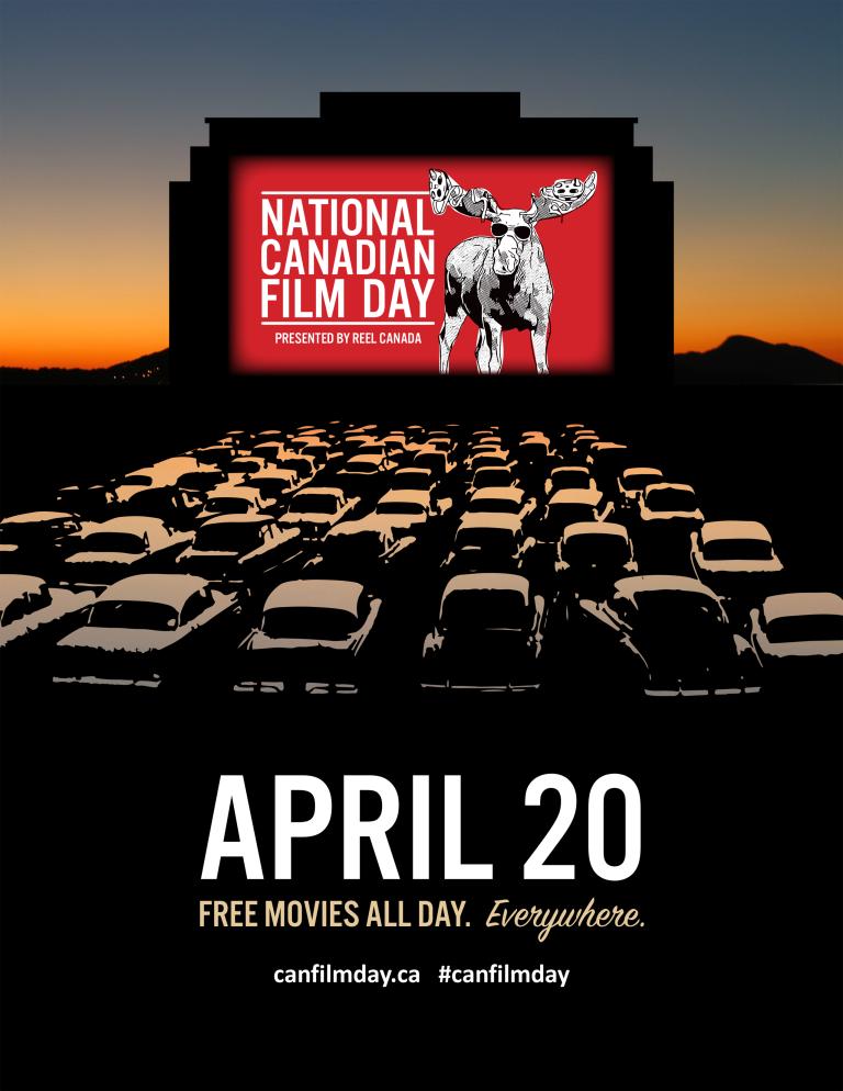 A drive through cinema with cars and a sunset behind the screen Partially obscured.